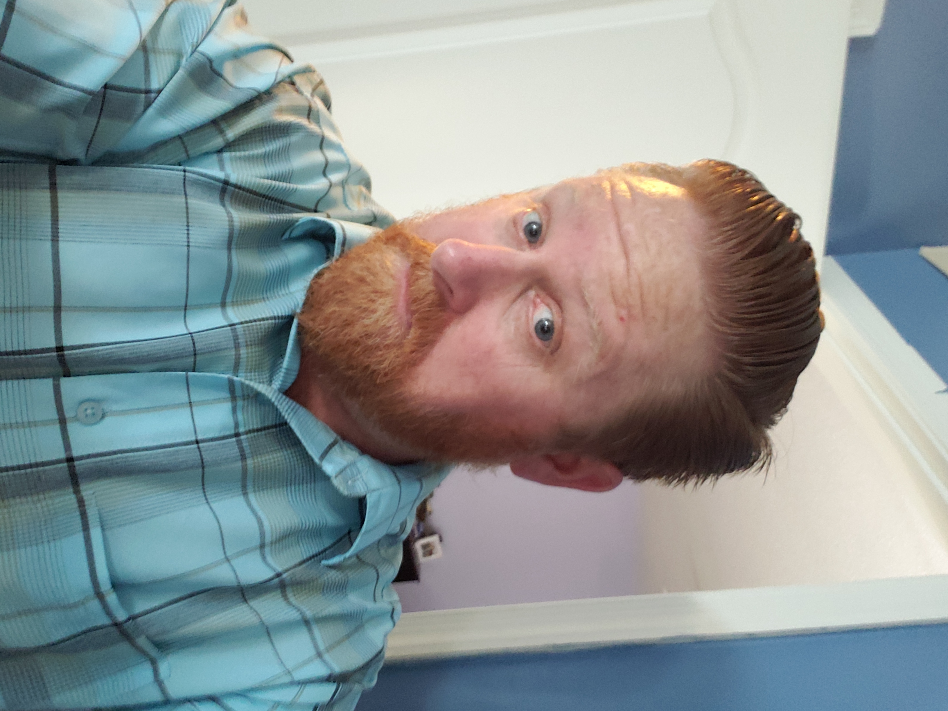 Chris, the redhead behind A Redhead Roams, on a coastal trail